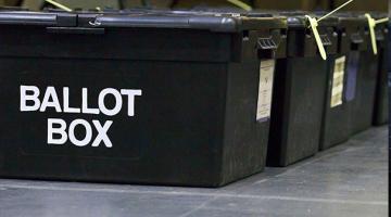 3 black boxes with 'ballot box' writing on them