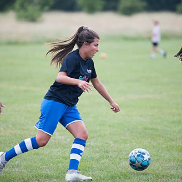 Women playing football.